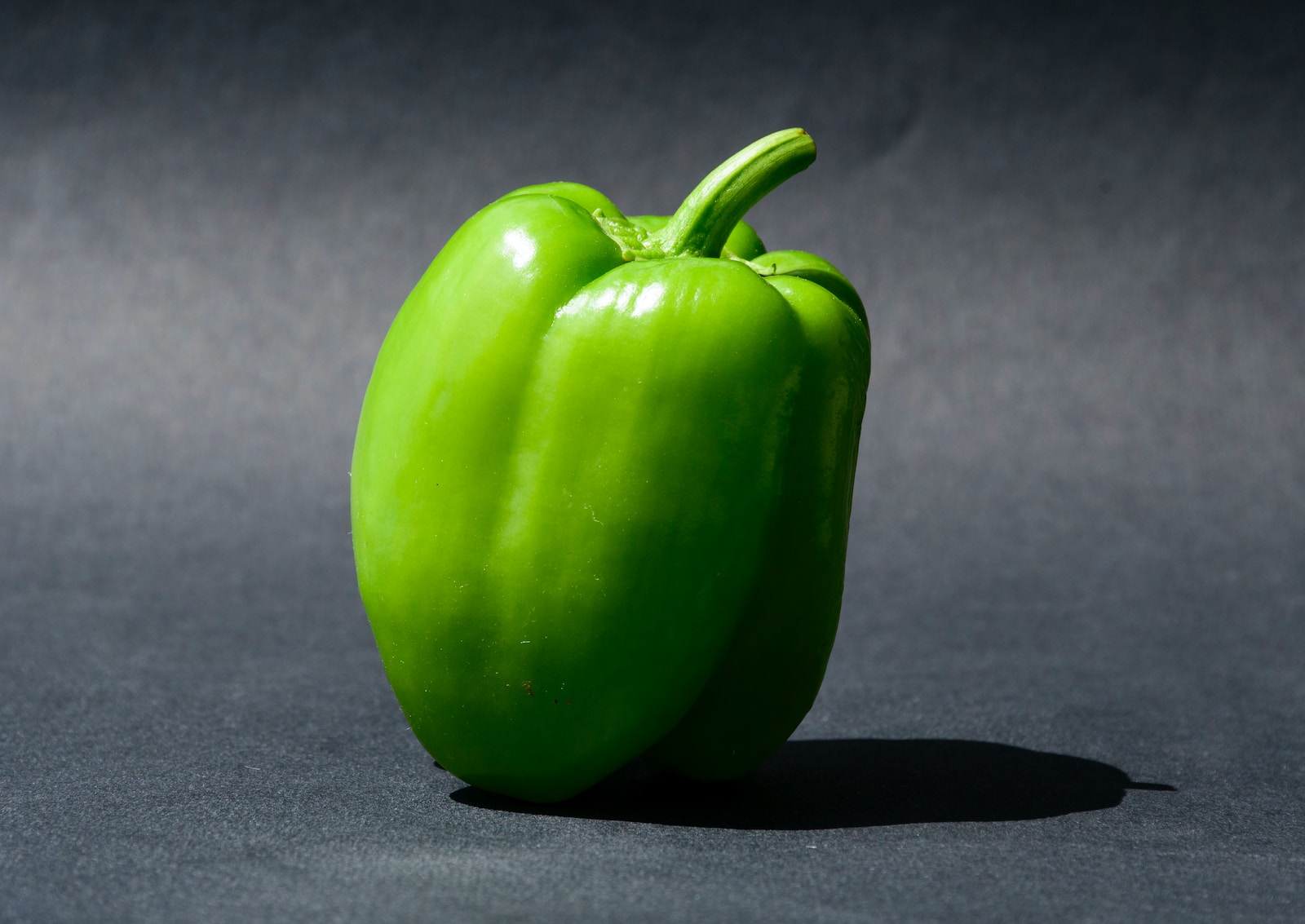 green bell pepper on black textile
